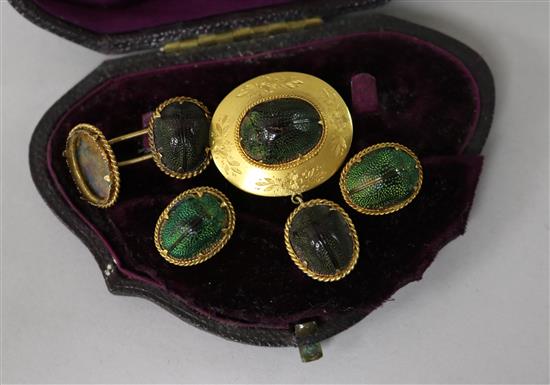 A 19th century yellow metal and scarab set drop brooch, a cufflink and two studs (a.f.).